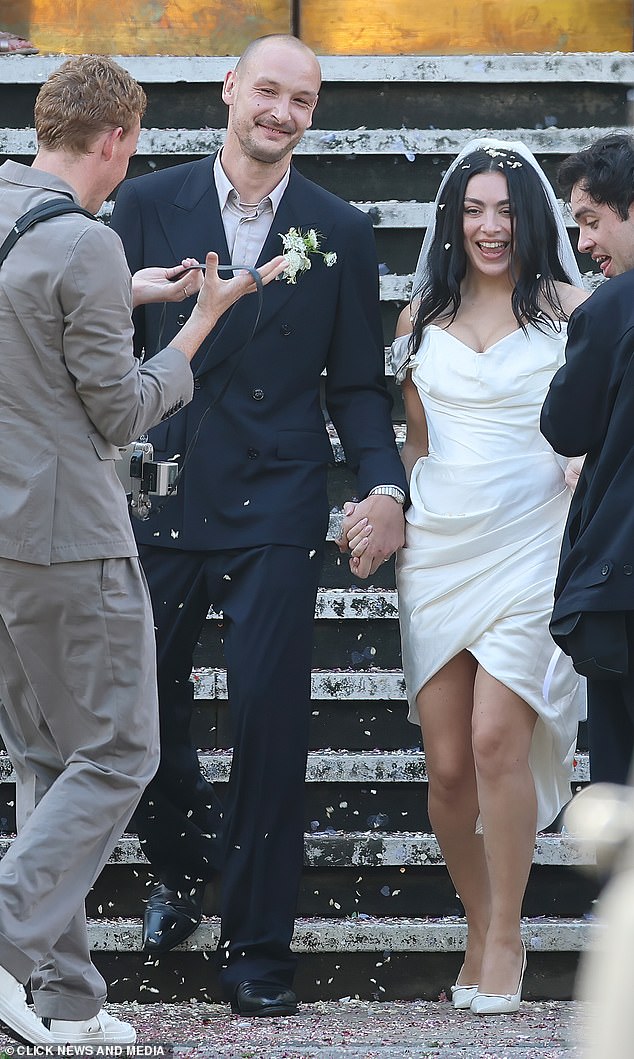Guests threw confetti as the pair emerged from Hackney Townhall