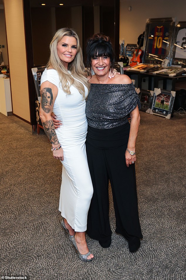 She added height to her frame with silver open toe heels and further accessorised with a dainty bracelet, and a silver wristwatch (pictured with Irene Strank)