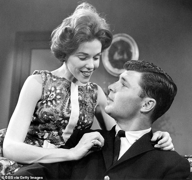 She won the hearts of fans as the scenery-chewing 'bad girl' Lisa Grimaldi, who is pictured with her first husband Bob Hughes (Don Hastings) in 1962