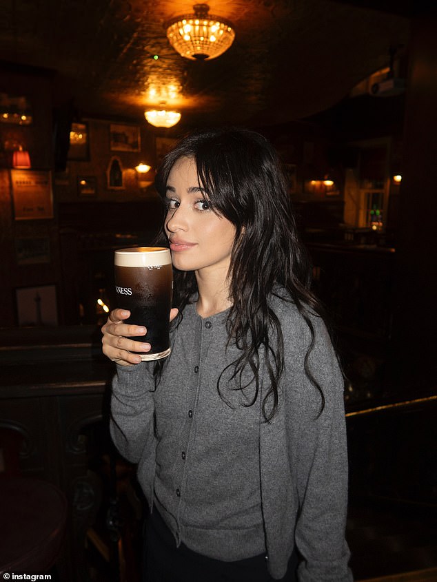 She kept low-key for the evening in a grey cardigan and stylish black mini skirt while at the J.R. Mahon’s Public House & Brewery