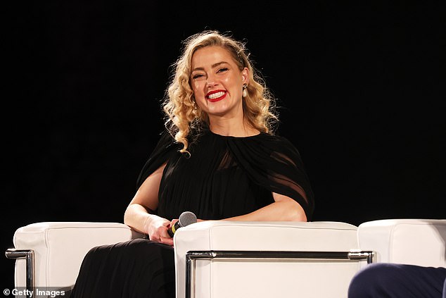 In January 2019, Amber (pictured in June 2023) graced the cover of Glamour's final print issue, wearing a low-cut, baby-blue satin suit and leaning against a shiny red convertible. The headline: 'Amber Heard: Silence Is Complacency'