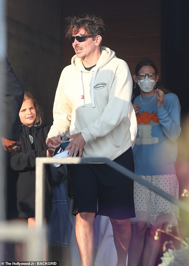 The A Star is Born director was joined by his daughter, Leah, eight, who looked adorable in a black hoodie dress. He shares his daughter with former partner, model Irina Shayk