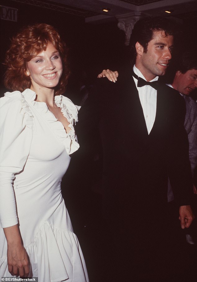 Henner began her career in the original stage production of Grease and dated Grease star John Travolta on-and-off for more than a decade; Pictured In Los Angeles in July 1983