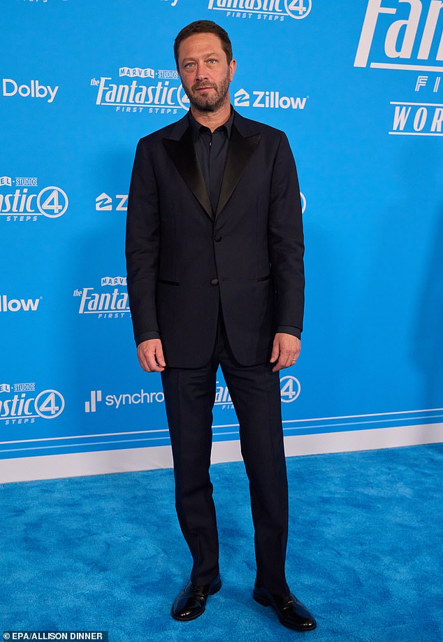 The 48-year-old Bear star - who plays Ben Grimm/The Thing - opted for all black suit and patent leather Oxfords with no necktie