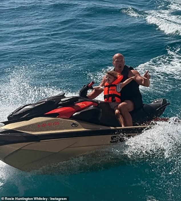 He sweetly cuddled them both on a sofa in the lavish vessel before he took Isabella on a jet ski and enjoyed a swim in the ocean himself