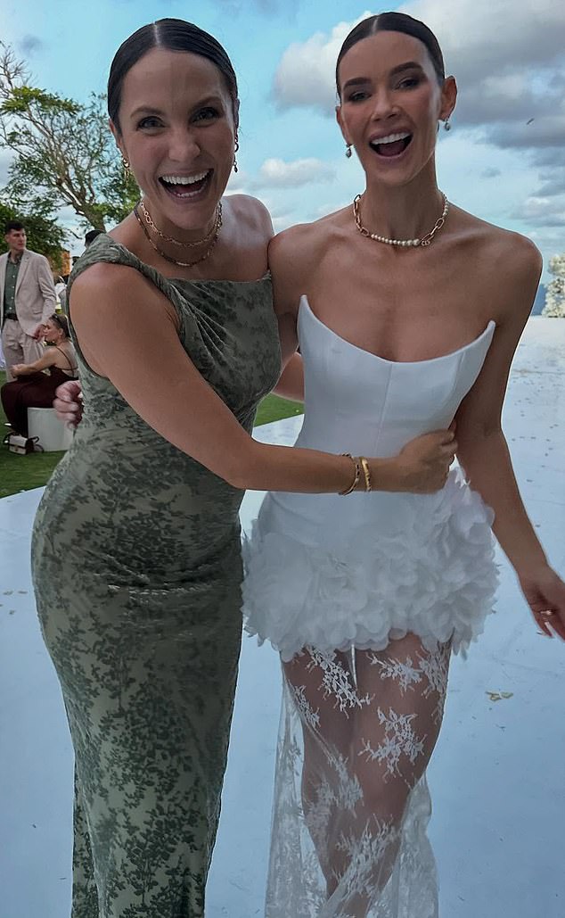 For her second number (pictured), Brittany slipped into another sleeveless, corseted dress, this time foregoing the lace for a mini floral skirt, complete with a sheer, lace fringe that fell to the floor