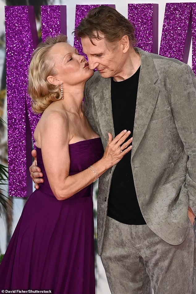 Pamela planted a sweet kiss on Liam's cheek as they posed for photos