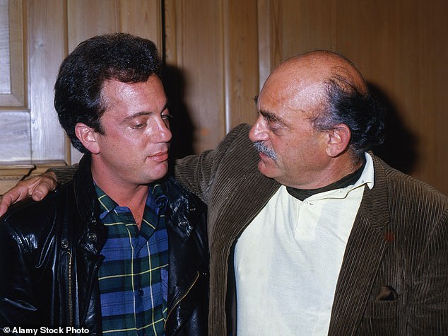 In the documentary, Joel recalls Howard “knocking me out” at age 8 over a piano mistake before eventually leaving the family for Europe, and says that even after they reconnected, searching for his father remained a driving force in his life; (Joel with father Howard Joel in 1986)