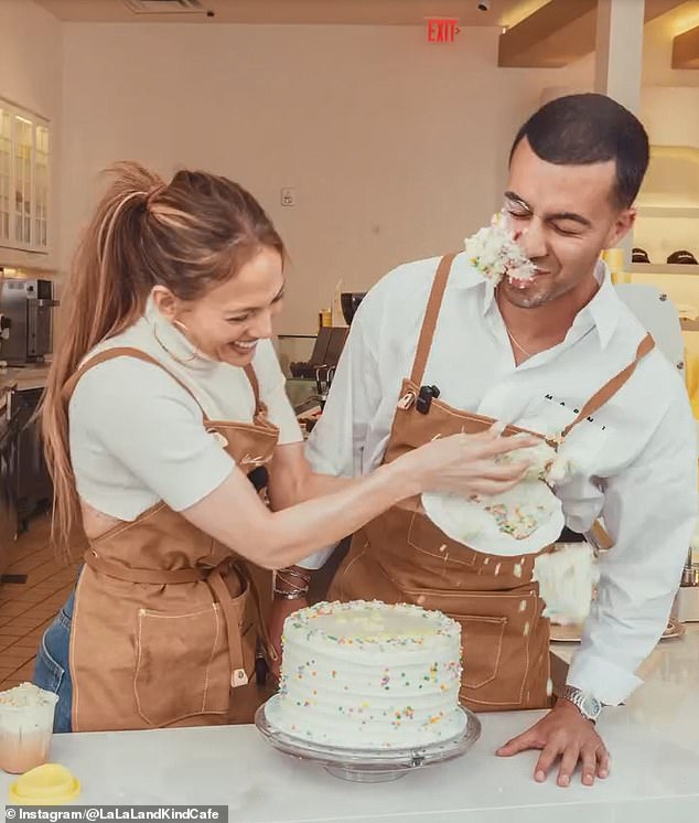 They both giggled after the wedding cake stunt