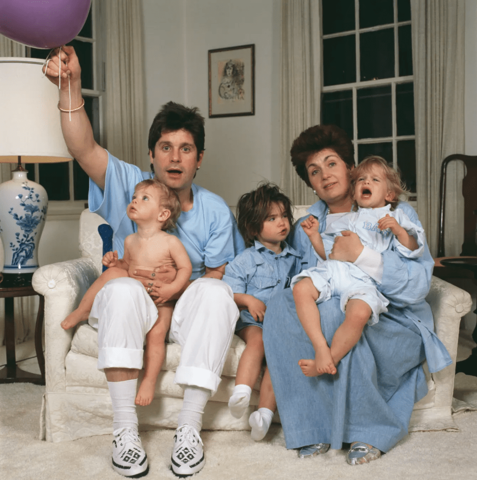 Family portrait of a man, woman, and three young children.