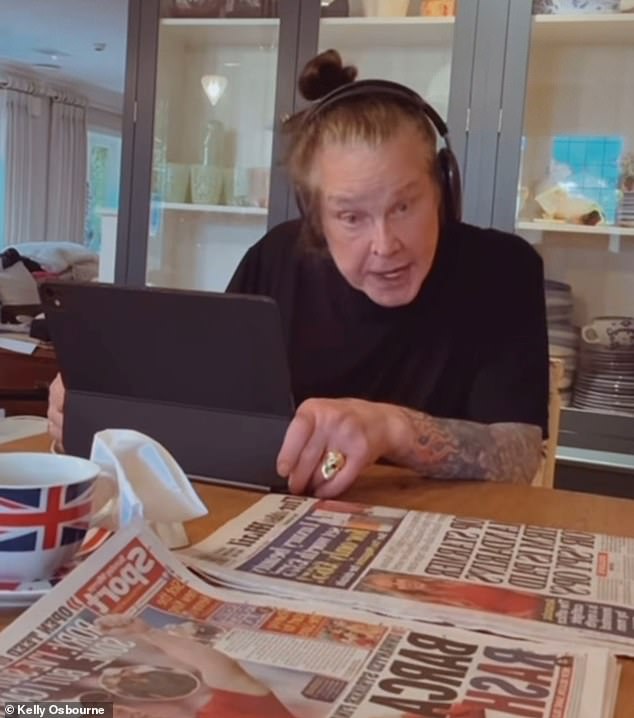 Kelly said: 'Good morning', before panning the camera to her father who was wearing a pair of headphones as she said, 'Dadda, say good morning', he replied 'Good morning!'