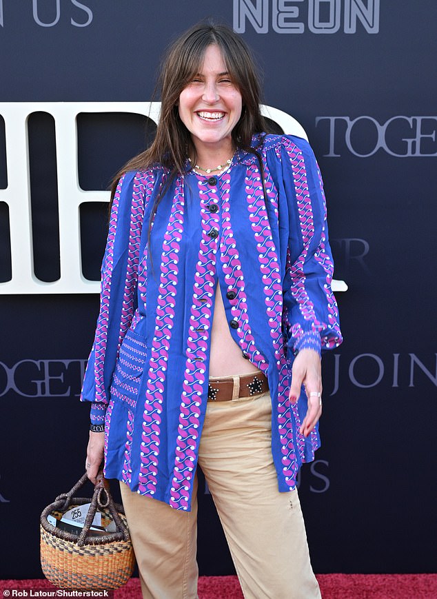 Scout LaRue Willis opted for an eye-catching blue and pink patterned jacket, teamed with beige trousers