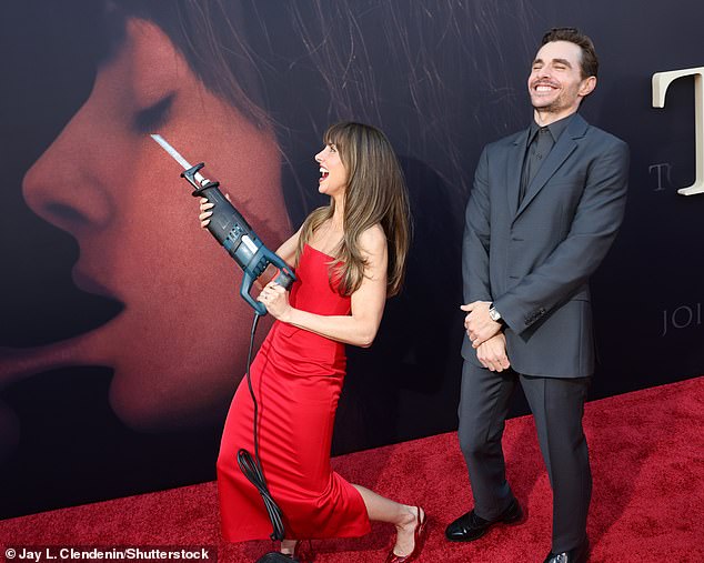 They then playfully posed for snaps with a fake chainsaw