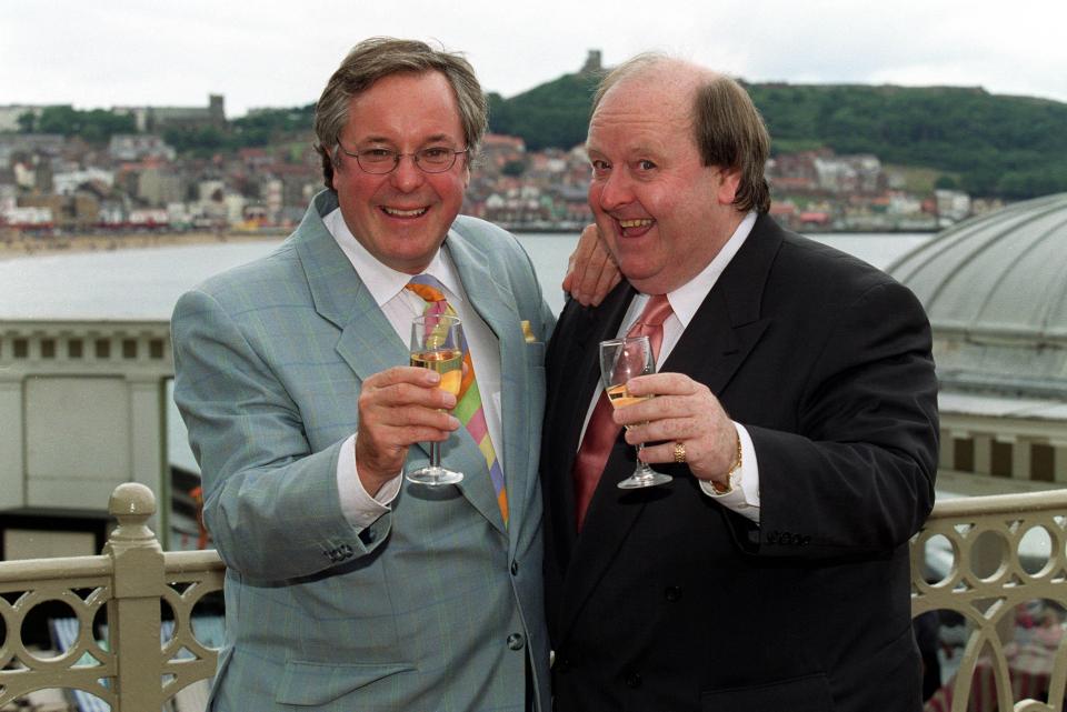 Richard Whiteley and Tony Peers toasting with champagne.