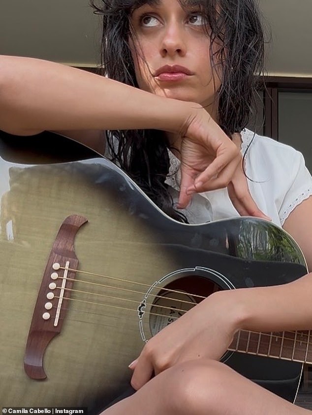 The former Fifth Harmony band member seen with her guitar