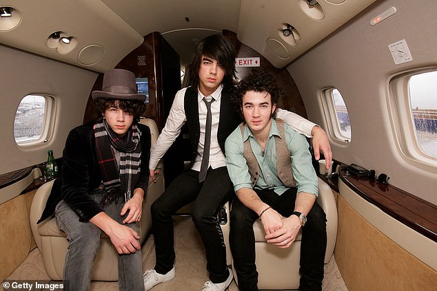 As the music artists rose to success in the early 2000s, they came to be known for their Christian backgrounds and regularly wearing purity rings; pictured in 2008