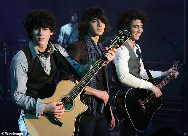 The trio opened up about being under a microscope at a young age; L-R Nick, Joe, and Kevin pictured in 2008