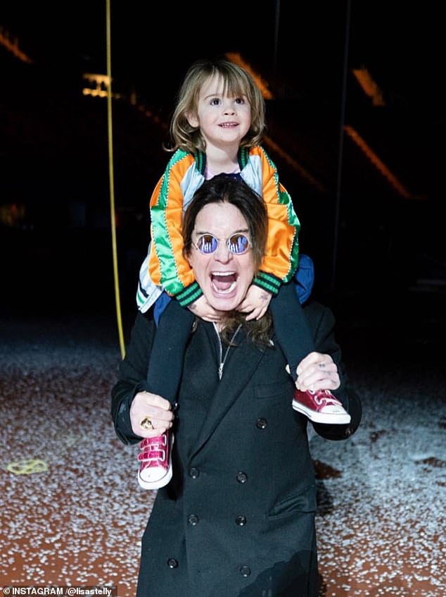 The rocker reverted to his trickster persona in a fun snap with one of his younger granddaughters. He showed off a playfully fierce open-mouthed look while giving the little girl a ride on his shoulders