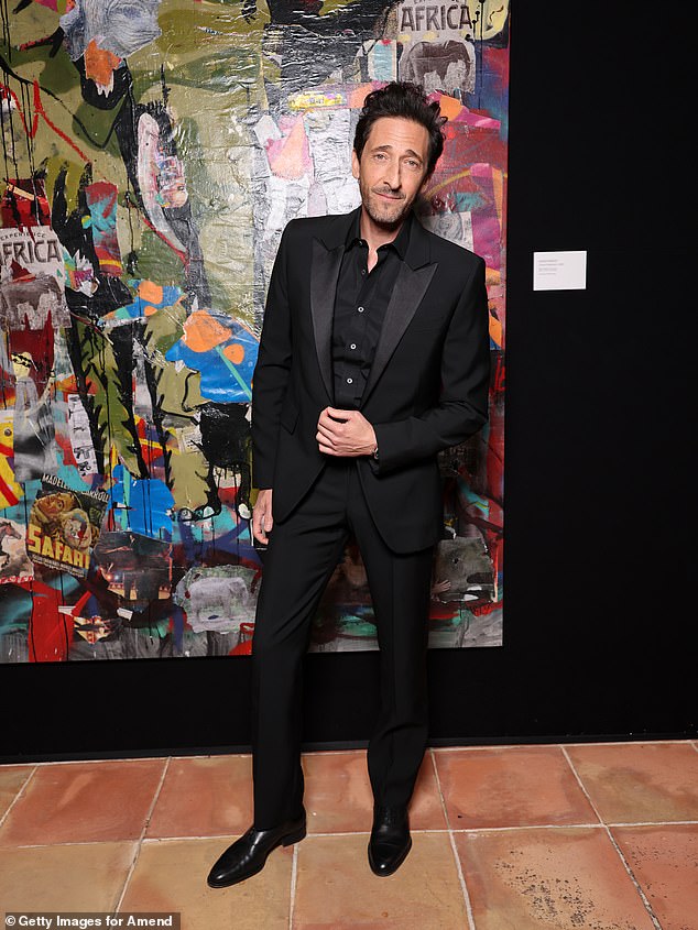 Adrien Brody looked dapper in a black suit and matching shirt