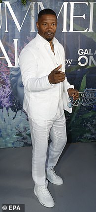 The singer, 34, posed up a storm on the red carpet, joining Jamie Foxx (pictured) at the glamorous event.