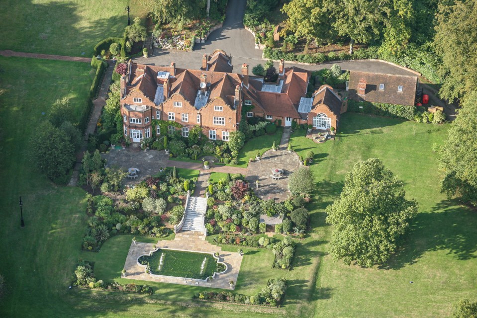 Aerial view of Welders House, a large brick mansion with extensive gardens.