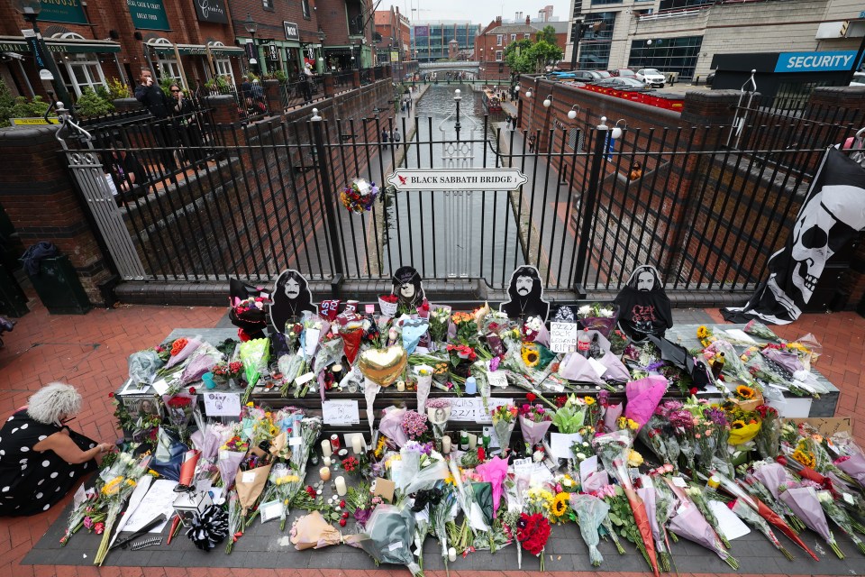 Floral tributes at the Black Sabbath Bridge in Birmingham following Ozzy Osbourne's death.
