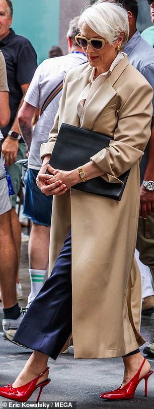 Meryl's costume was perfectly fitted to highlight her lithe frame, from the tucked-in white blouse to the midnight blue slacks to the slimming camel coat