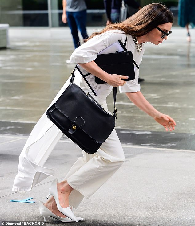 One consisted of a half-sleeved white top with a floor-length cape, teamed with matching trousers and a snowy pair of kitten heels