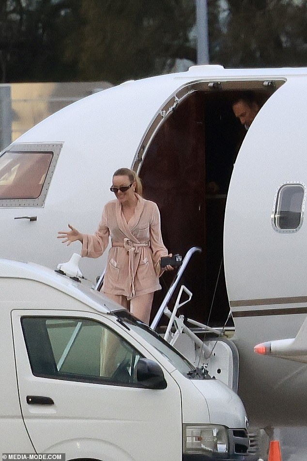Madeline attempted to go incognito, wearing oversized sunglasses as she exited the plane