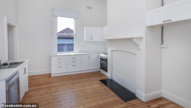 House number eight features three bedrooms, a sitting room that could double as a fourth, Baltic pine floors, decorative fireplaces and pressed-metal ceilings