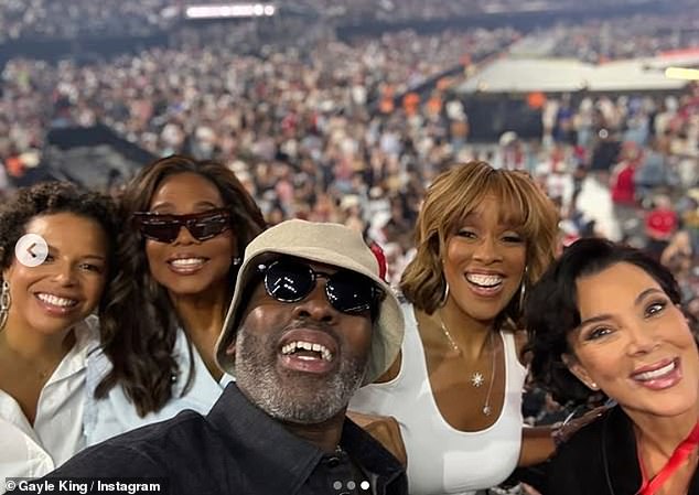 Kris' partner, Corey Gamble, posed front and center