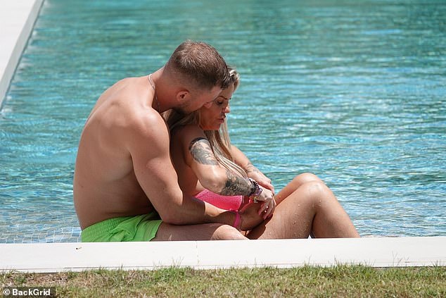 The couple put on a loved-up display in the swimming pool
