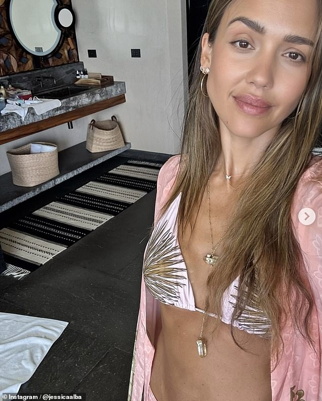 In the post, she showed off her toned physique in a light pink bikini as well as a brown bandeau two-piece as she documented her time away