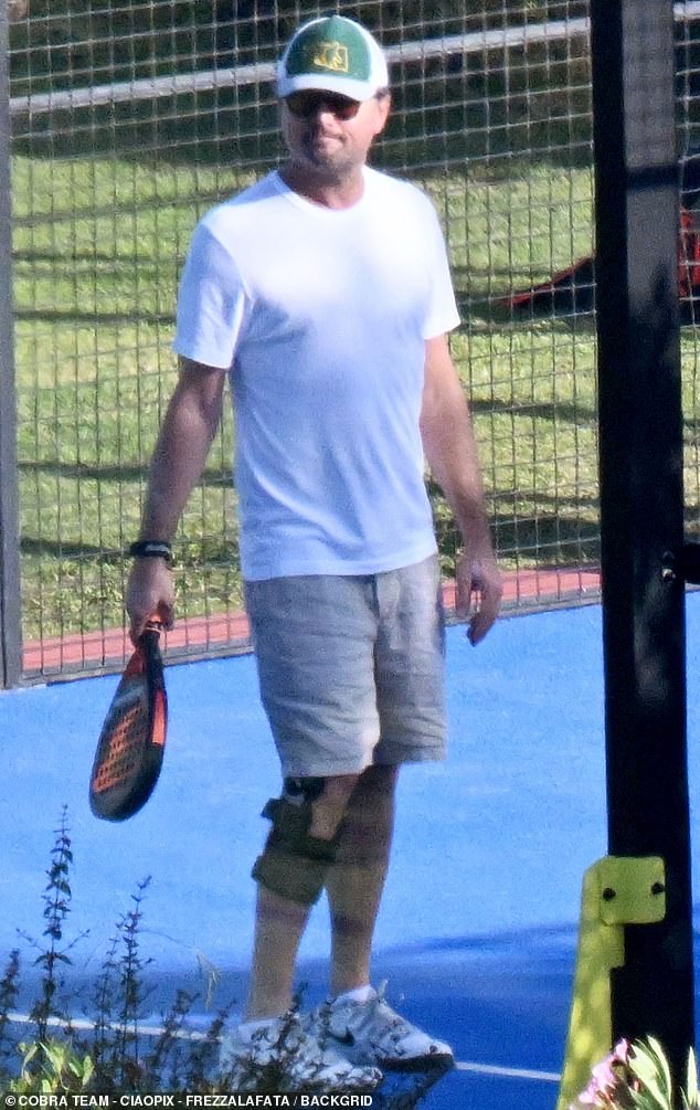 Leonardo also slipped into a pair of white Nike sneakers and donned a green-and-white cap
