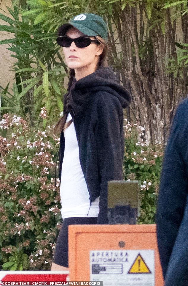 Vittoria's brunette locks were styled into two braids covered by a green baseball cap