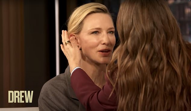 With a soft smile and a twinkle in her eye, Drew gently smoothed Cate¿s hair and said sweetly, 'Let me make sure everything is perfect. You deserve to look beautiful'