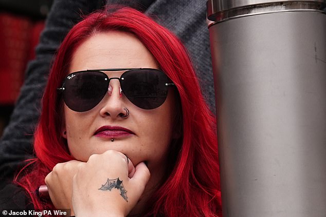 Pictured is one among thousands of Ozzy Osbourne fans gathering in Birmingham today