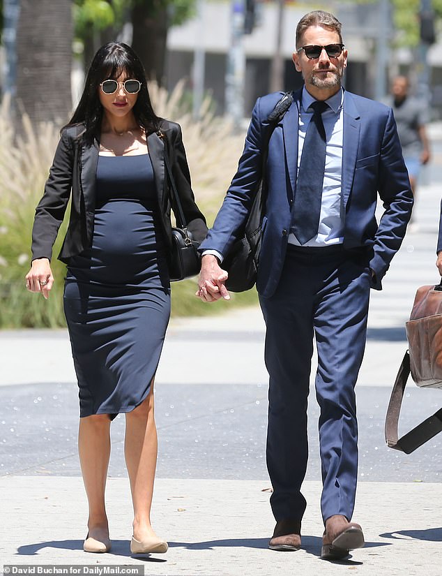 Alice is in the midst of a legal dispute with ex-husband Ioan Gruffudd  (pictured outside court with new wife Bianca Wallace) regarding child support payments for their two daughters