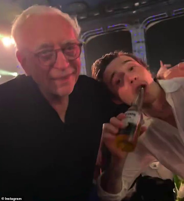 Brooklyn was also seen embraced his billionaire father-in-law Nelson, 83, as they enjoyed a beer together