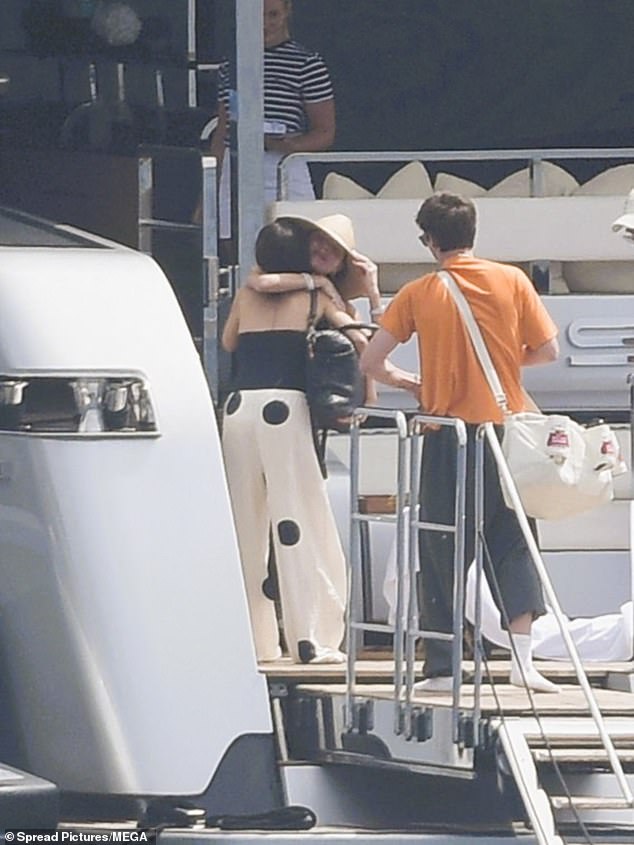 Victoria Beckham welcome her son Cruz, 20, and his girlfriend Jackie Apostel, 30, on board their boat this week amid frosty relations with Brooklyn