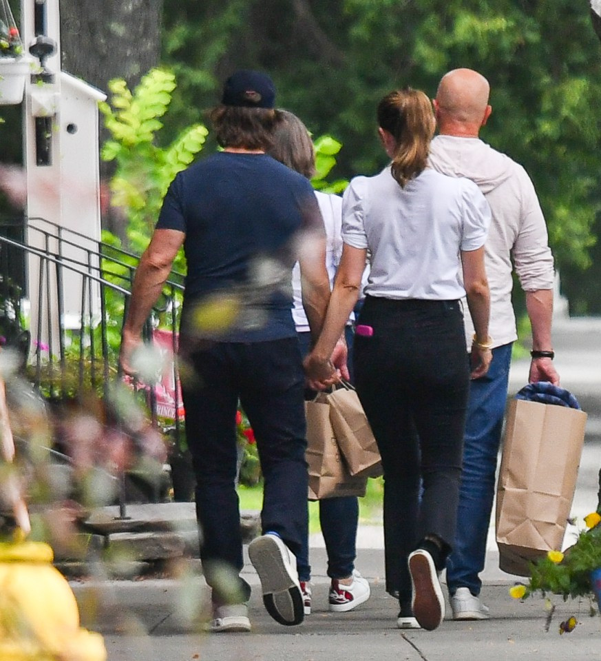 Tom Cruise and Ana de Armas holding hands while shopping.