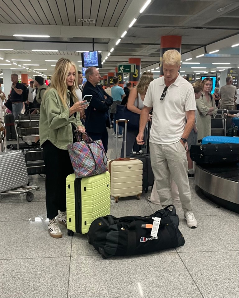 Fearne Cotton and a man at an airport baggage claim.