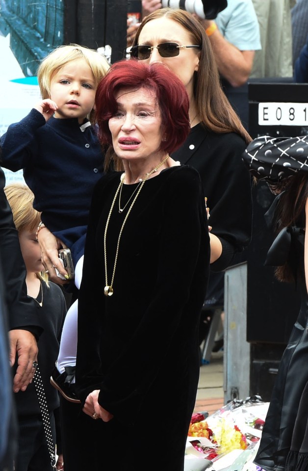 Sharon Osbourne and family at a funeral.