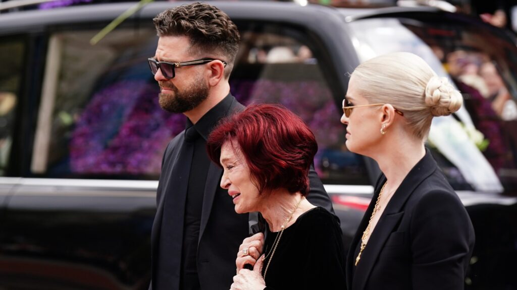 Heartbreaking moment Kelly and Jack Osbourne cling to mum Sharon as she’s overcome with grief at Ozzy memorial