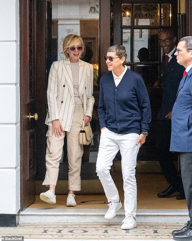 She looked casual in a cardigan and white jeans, while Portia wore a stylish double-breasted sport coat and cargo pants. They loved-up couple held hands while strolling on Bond Street