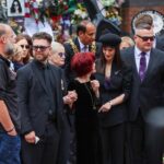 Ozzy Osbourne’s rarely seen daughter Aimee lays flowers as she joins family at emotional funeral procession