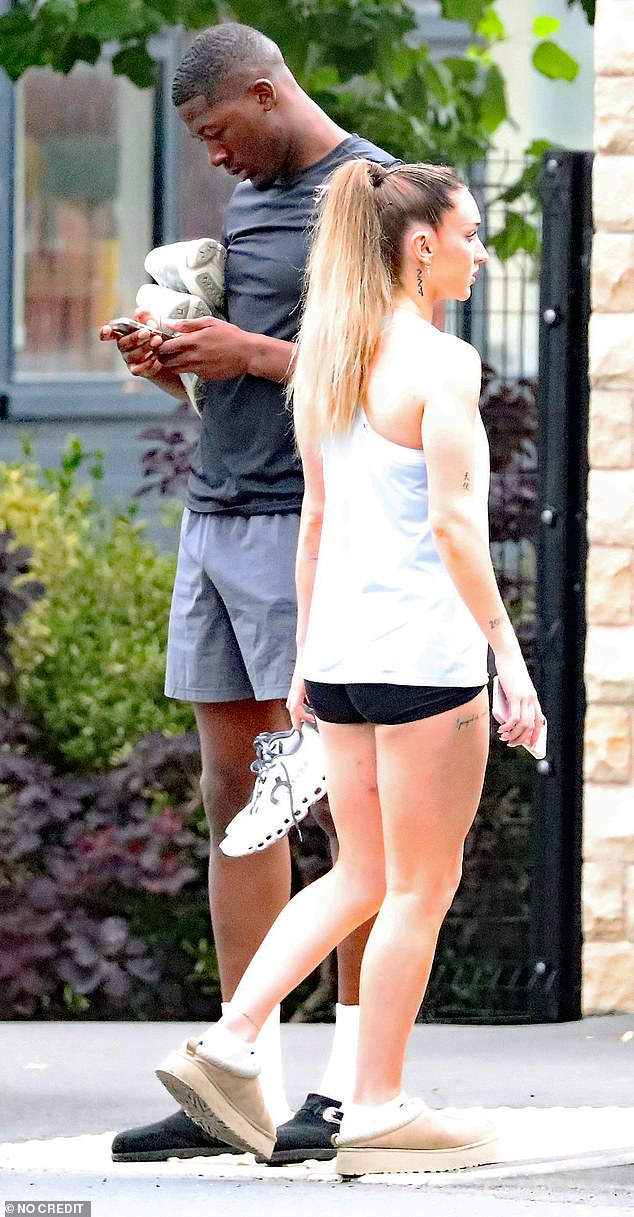 Ayo and Alicia were seen outside a Manchester coffee shop this week waiting for a taxi to collect them, wearing sports casual ensembles