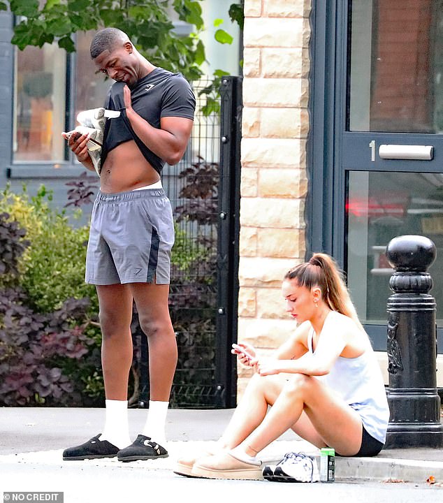 The influencer was wearing a black T-shirt with grey shorts, adding black Birkenstocks and white socks