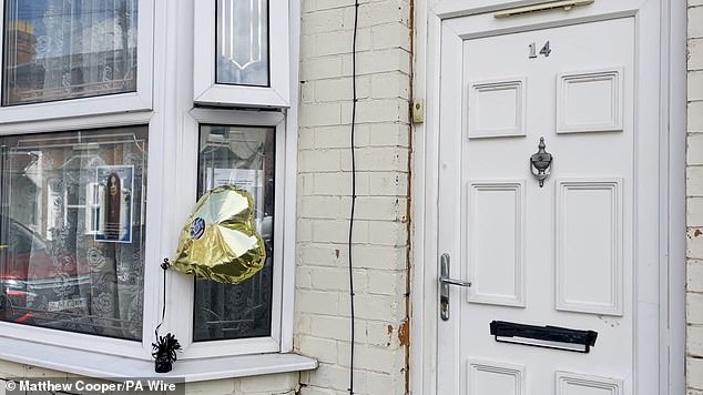 Tributes were displayed outside the home where Ozzy grew up in the district of Birmingham