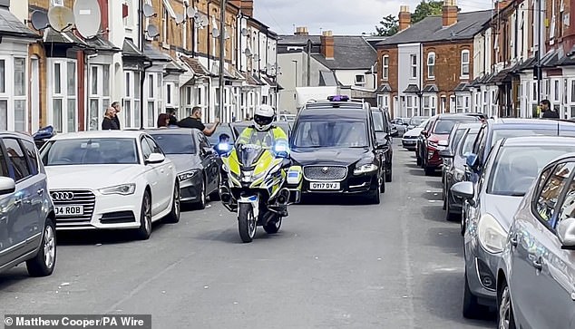 Ozzy Osbourne's coffin and cortege is seen passing his childhood home in Lodge Road, Aston